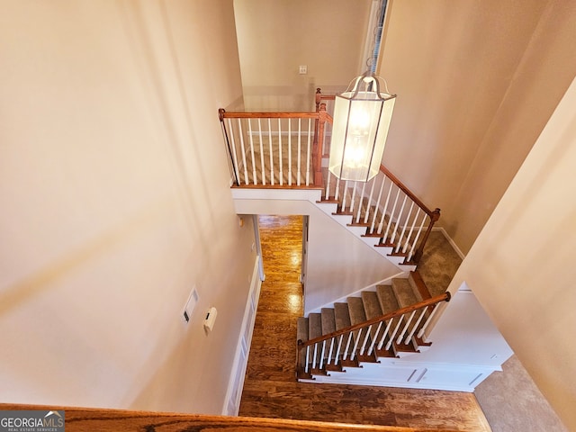 staircase featuring hardwood / wood-style floors