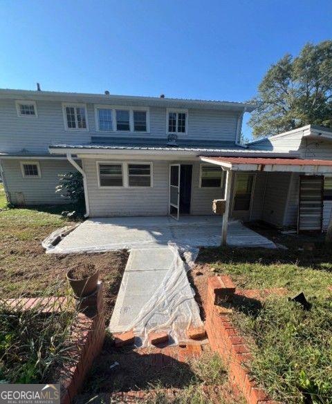 rear view of house featuring a patio