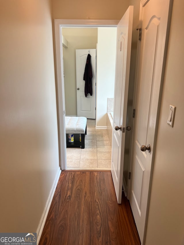 hallway featuring hardwood / wood-style flooring