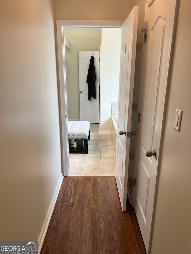 165 Summit Point Dr, Fayetteville, GA 30214 - hallway with baseboards and wood finished floors