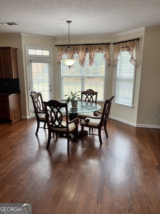 165 Summit Point Dr, Fayetteville, GA 30214 - dining area with a textured ceiling, dark wood-style flooring, plenty of natural light, ornamental molding, and baseboards