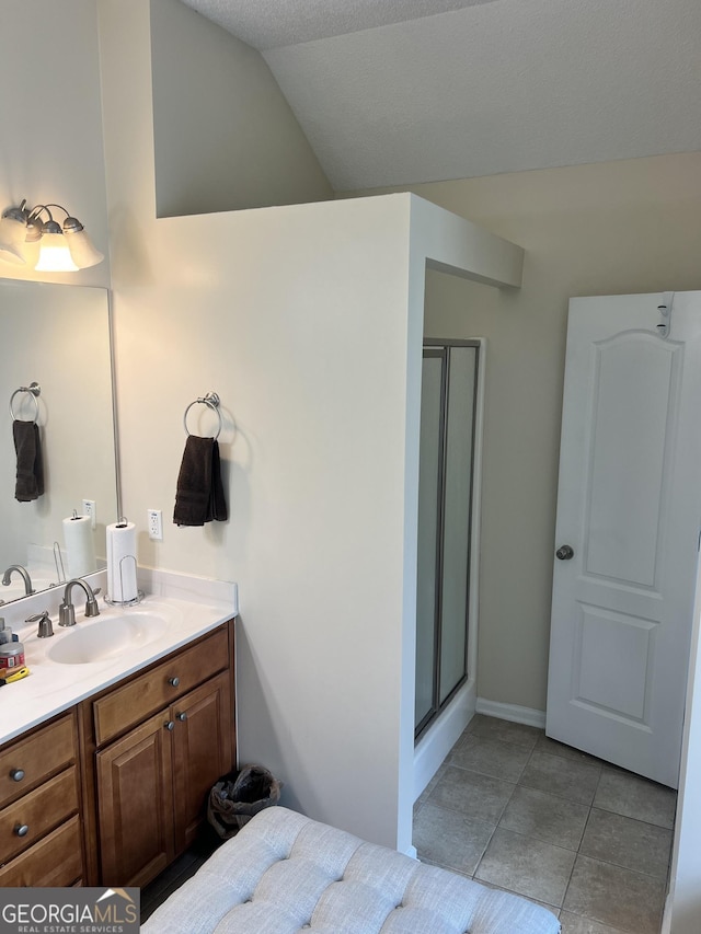 165 Summit Point Dr, Fayetteville, GA 30214 - bathroom with vanity, a stall shower, tile patterned floors, and lofted ceiling