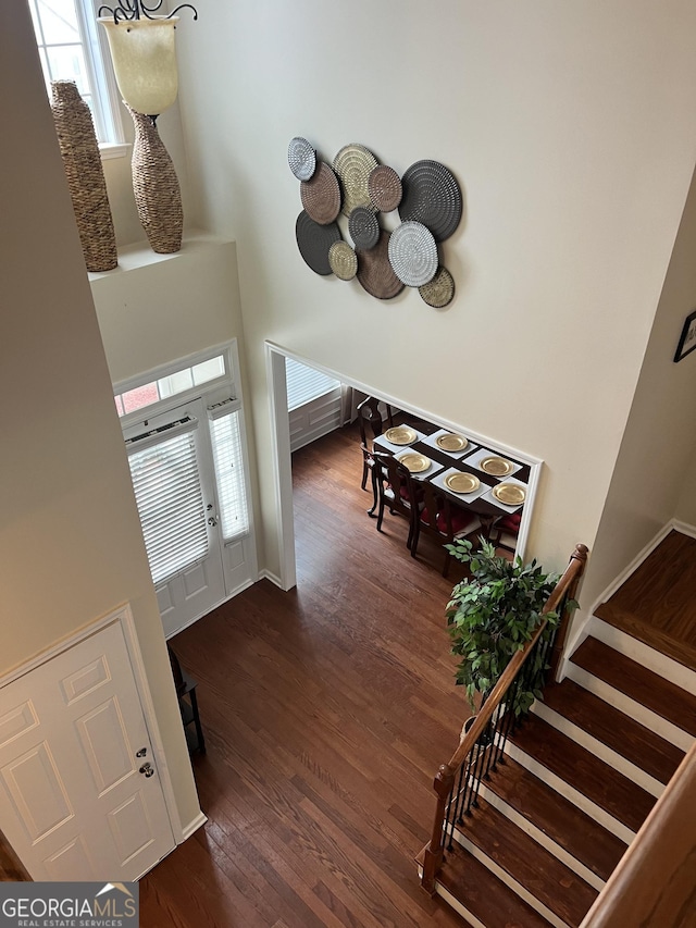 165 Summit Point Dr, Fayetteville, GA 30214 - staircase featuring wood finished floors and a towering ceiling