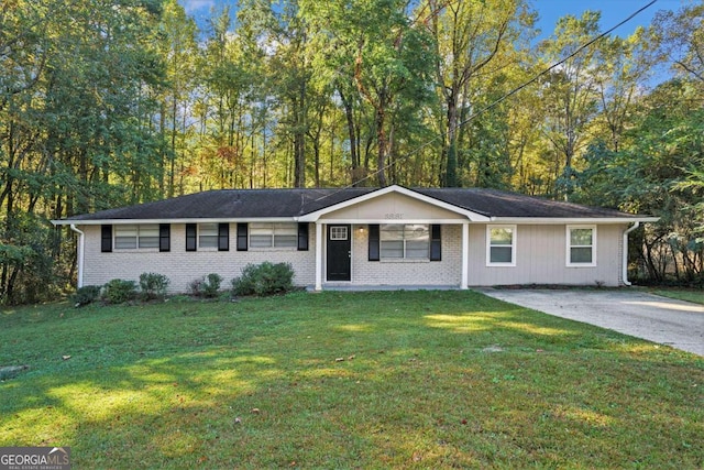 ranch-style house with a front lawn