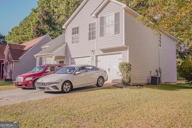 view of front facade featuring a front yard, a garage, and central AC unit