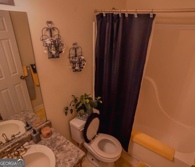 full bathroom featuring vanity, toilet, and shower / bath combo with shower curtain