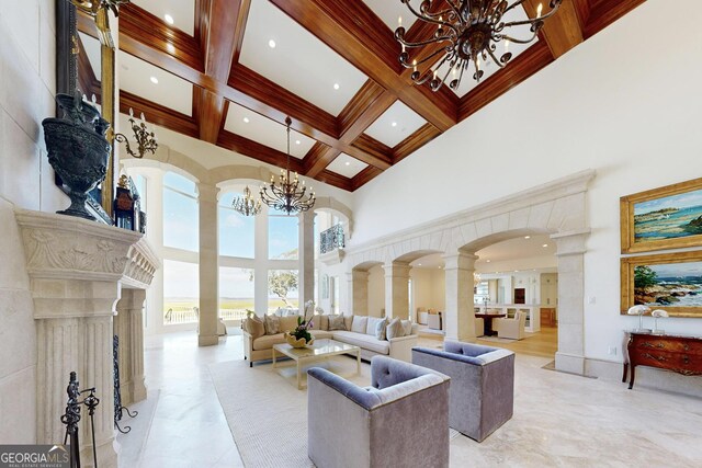 entryway with plenty of natural light, ornamental molding, and a water view