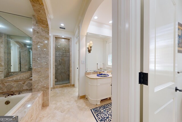 bathroom with vanity, separate shower and tub, and ornamental molding