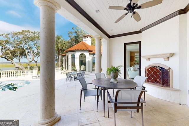 view of patio / terrace featuring a gazebo and ceiling fan