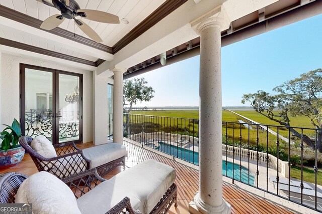 exterior space with ornamental molding, beamed ceiling, and light wood-type flooring