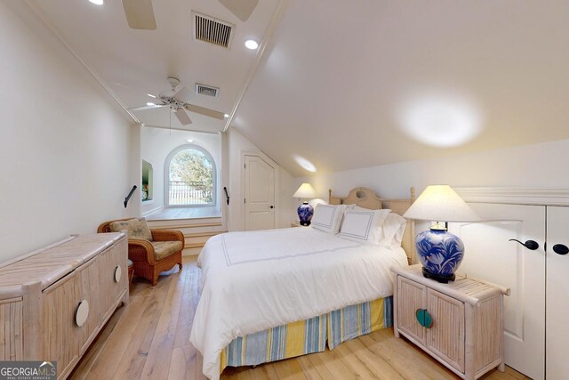 bedroom with access to exterior and light wood-type flooring