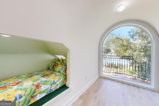 interior space with french doors, light tile patterned flooring, and high vaulted ceiling