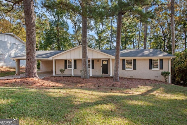 ranch-style house with a front lawn