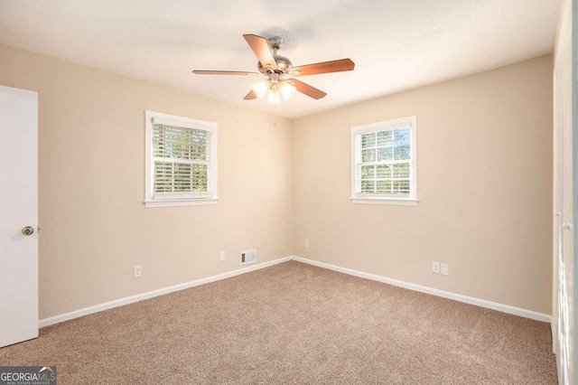 unfurnished room featuring carpet floors and ceiling fan