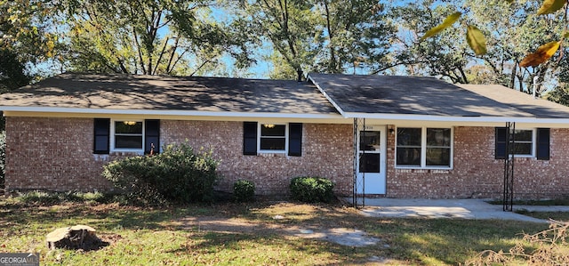 ranch-style house with a front yard