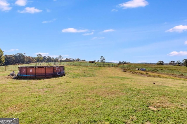 view of yard with a rural view