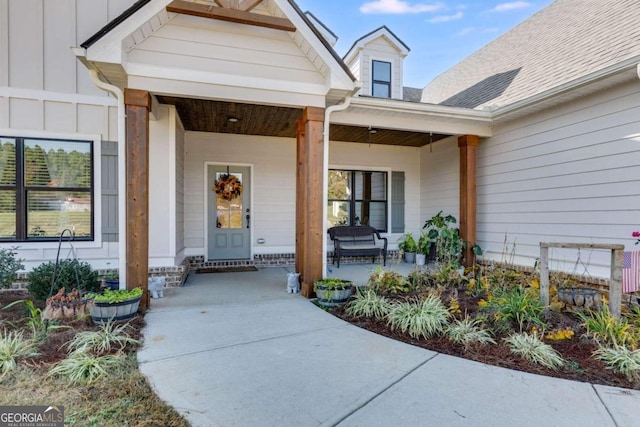 view of exterior entry with covered porch