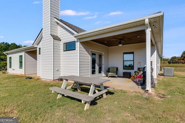 back of property featuring a yard, cooling unit, a patio, and ceiling fan