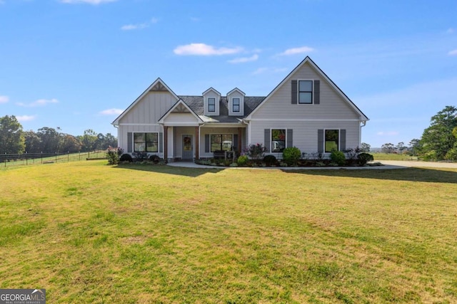 view of front facade featuring covered porch and a front lawn