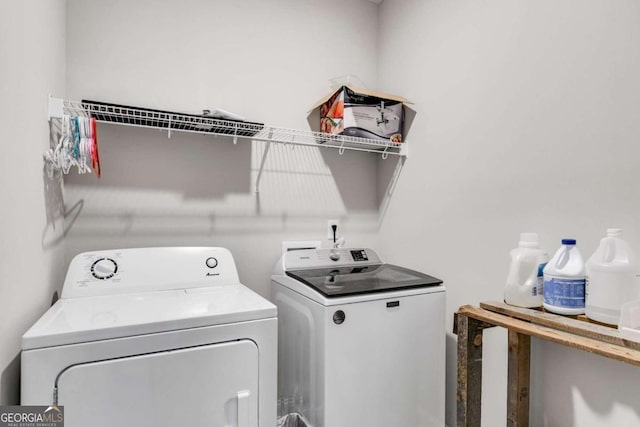 laundry room featuring washing machine and dryer