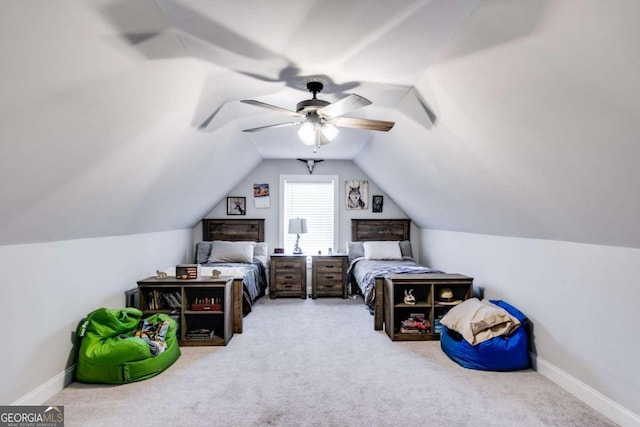 carpeted bedroom with lofted ceiling and ceiling fan