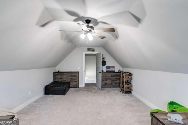 bonus room featuring lofted ceiling, light colored carpet, and ceiling fan