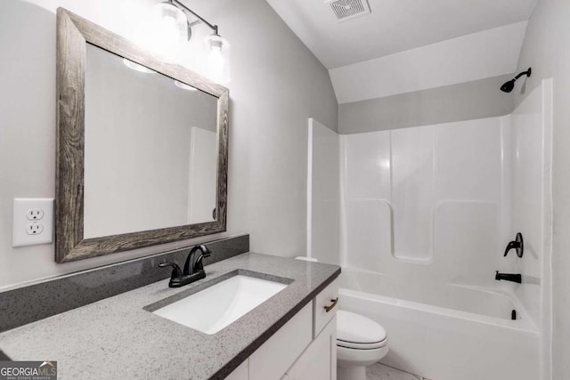 full bathroom featuring toilet, shower / bathing tub combination, vanity, and lofted ceiling