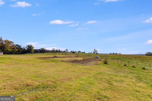 view of yard with a rural view