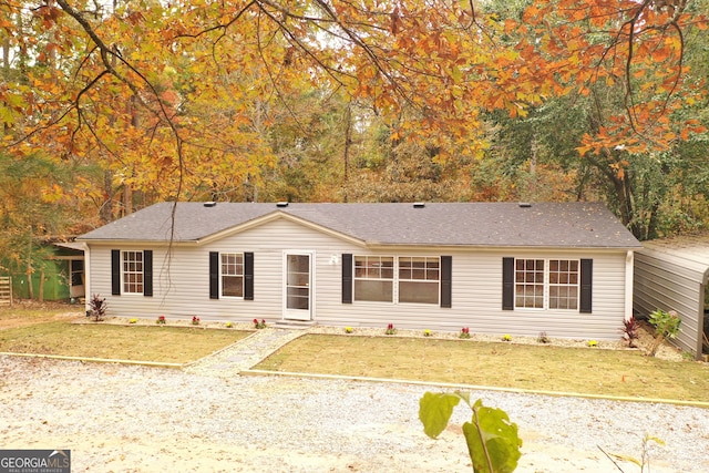 ranch-style home featuring a front yard