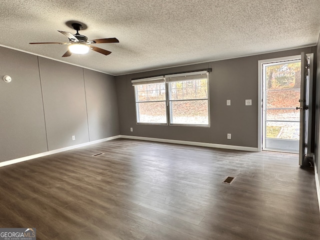 spare room with ornamental molding, ceiling fan, a textured ceiling, and dark hardwood / wood-style flooring