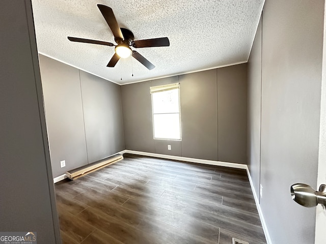 unfurnished room featuring a textured ceiling, dark hardwood / wood-style flooring, ceiling fan, baseboard heating, and crown molding