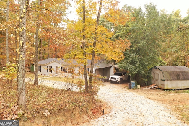 view of front of property with a shed