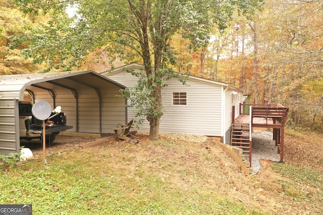 view of home's exterior featuring a wooden deck and a carport