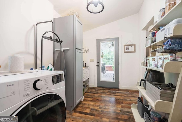 laundry room with washer / dryer and dark hardwood / wood-style flooring