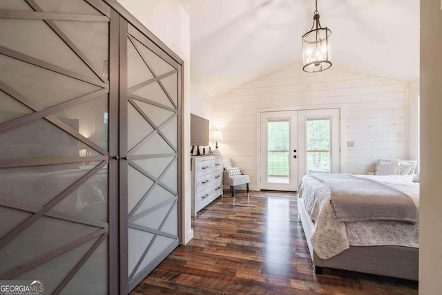 bedroom featuring french doors, access to exterior, lofted ceiling, dark wood-type flooring, and a notable chandelier