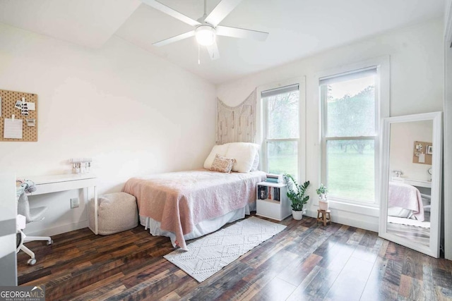 bedroom featuring dark wood-type flooring and ceiling fan