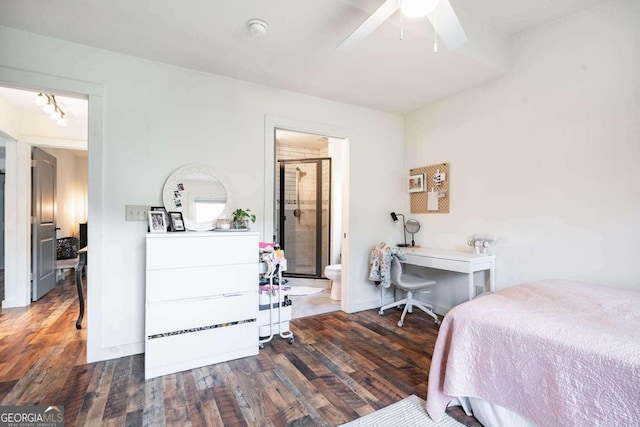 bedroom with ensuite bath, dark wood-type flooring, and ceiling fan