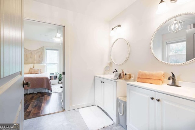 bathroom featuring vanity, hardwood / wood-style floors, and ceiling fan