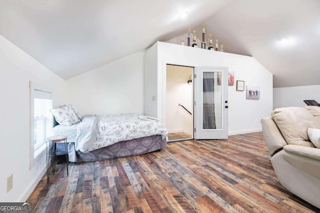 bedroom featuring lofted ceiling and dark wood-type flooring