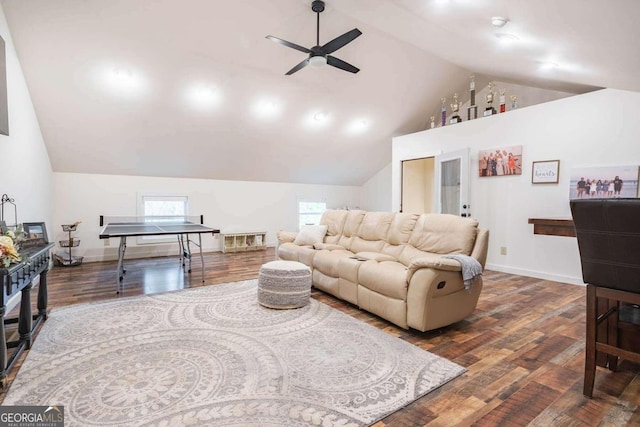 living room featuring ceiling fan, high vaulted ceiling, and dark hardwood / wood-style flooring