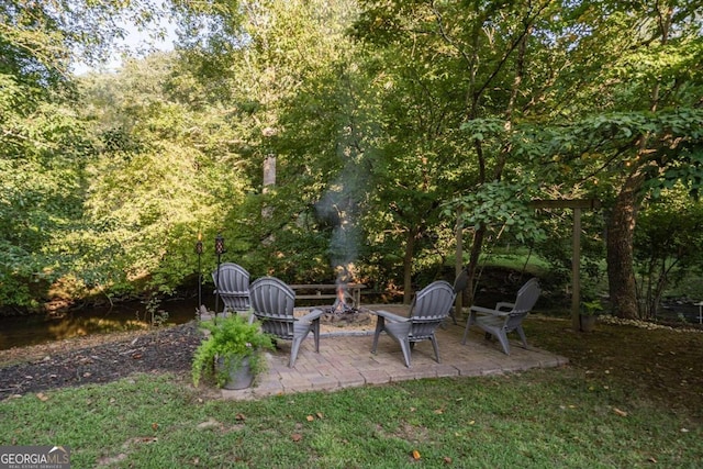 view of patio with a fire pit