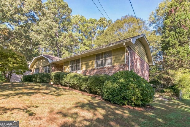 view of property exterior featuring a yard