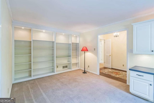 spare room with crown molding and light carpet