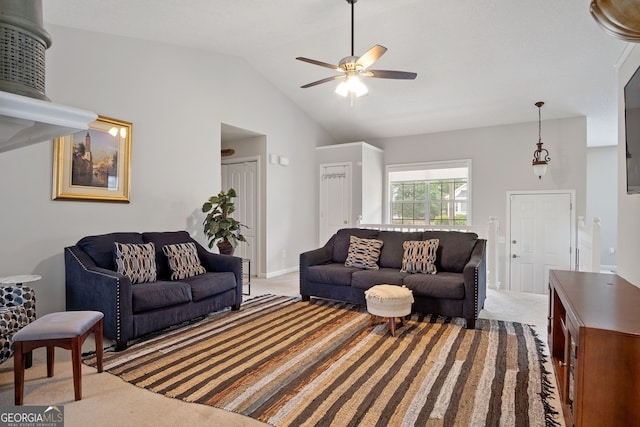 living room with light carpet, lofted ceiling, and ceiling fan