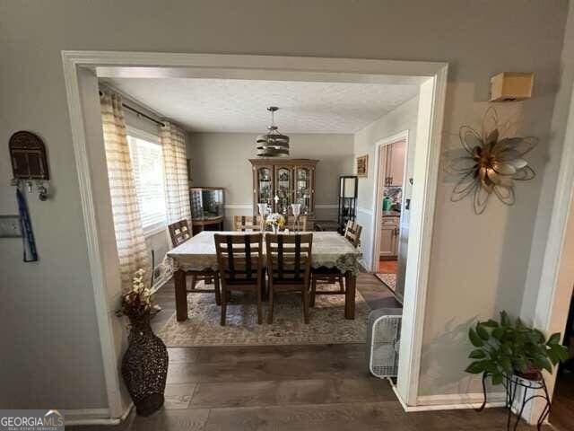 dining room with a textured ceiling