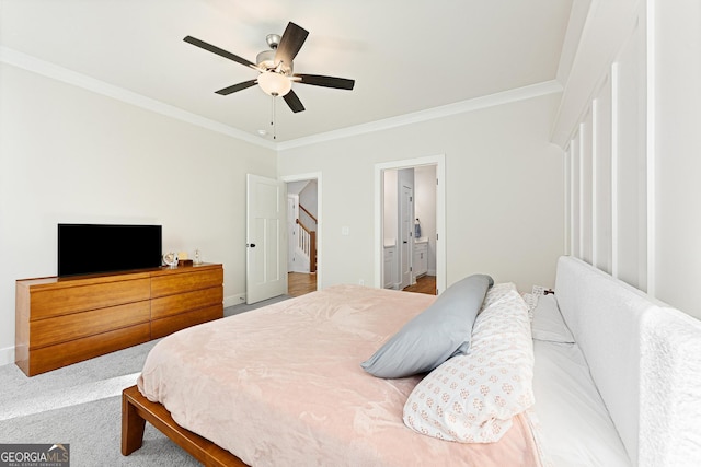 bedroom featuring ornamental molding, connected bathroom, carpet, and ceiling fan