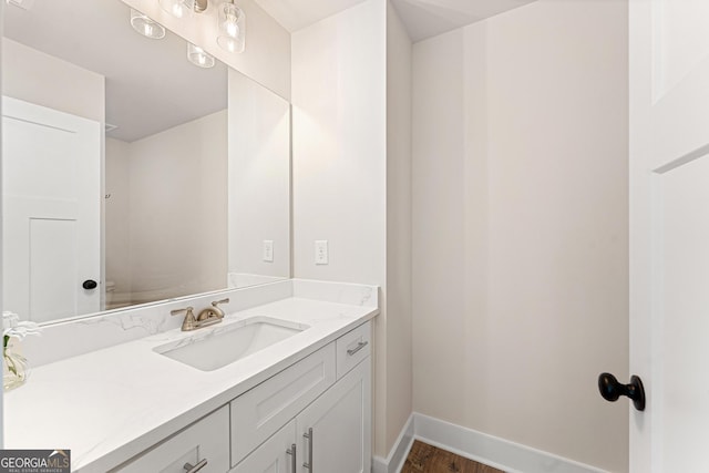 bathroom with vanity and hardwood / wood-style floors