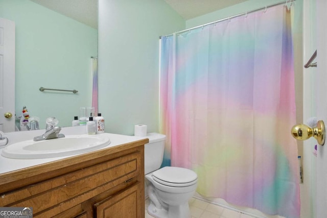 bathroom featuring vanity, toilet, and a shower with shower curtain