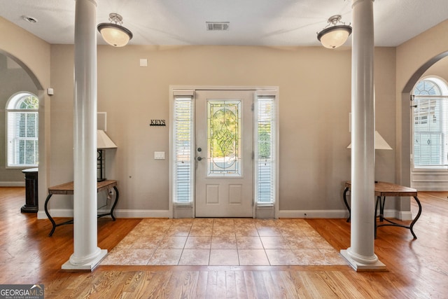 foyer featuring a wealth of natural light and light hardwood / wood-style flooring