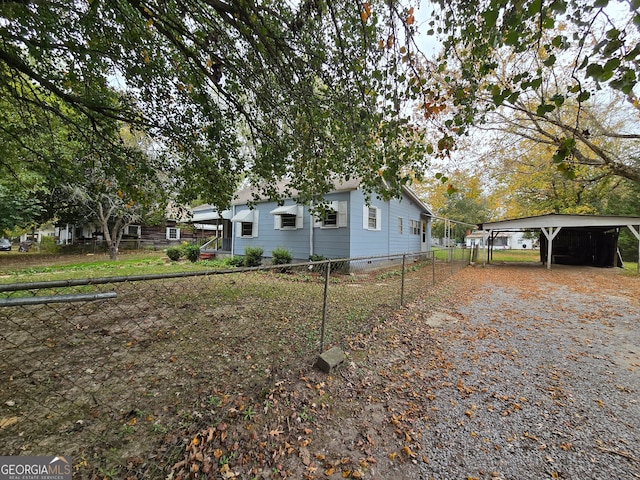 view of side of property featuring a carport